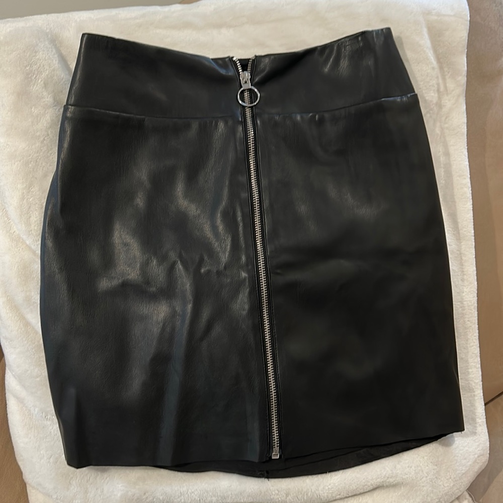 Express black faux leather mini skirt. Zips in front to close, never worn